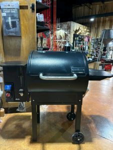 pellet grill smoking brisket in backyard BBQ
